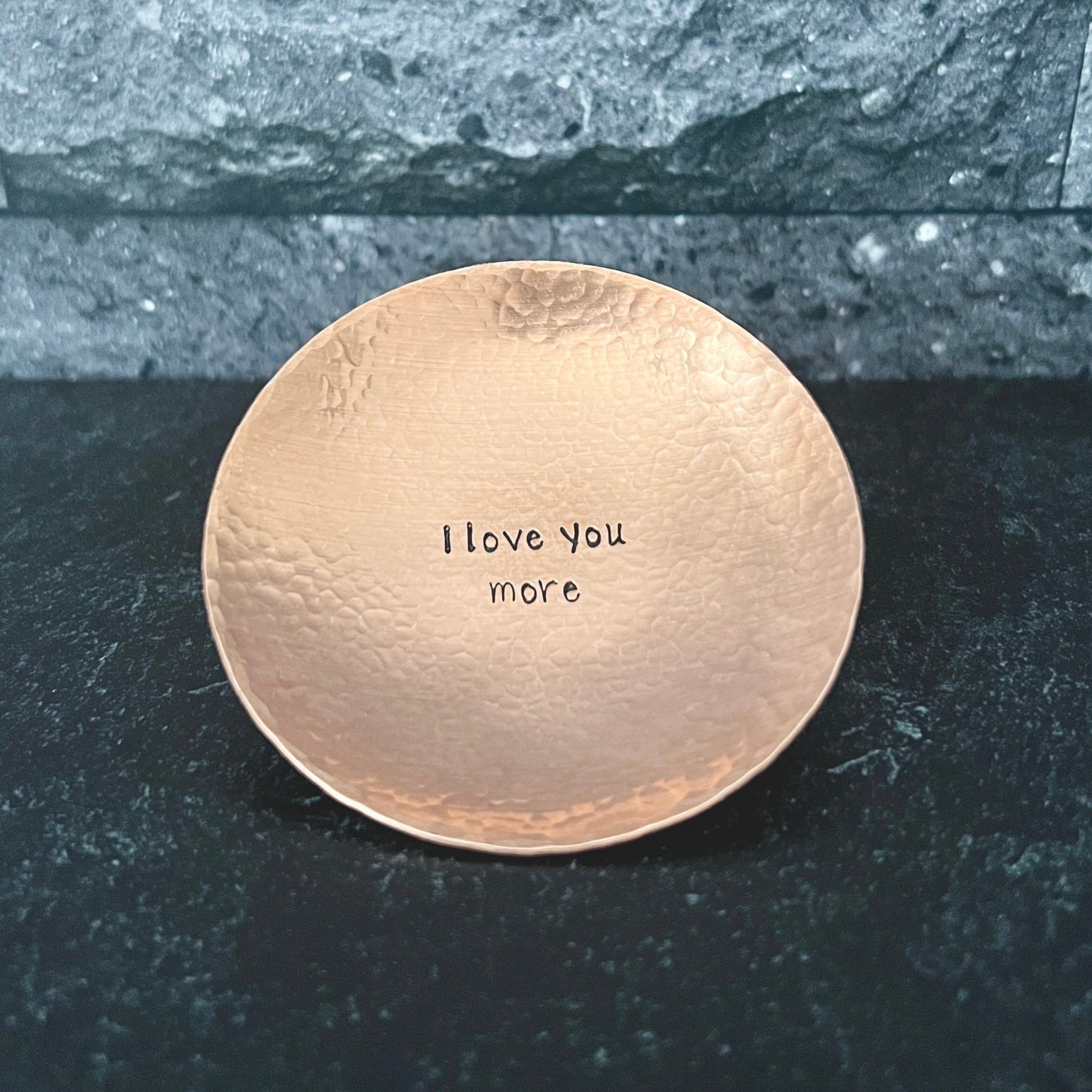 handmade hammered copper ring dish. Dish shown has a personalized message hand stamped in the center of the dish. Personalize your dish with your message in the center and/or along the top and bottom rim.